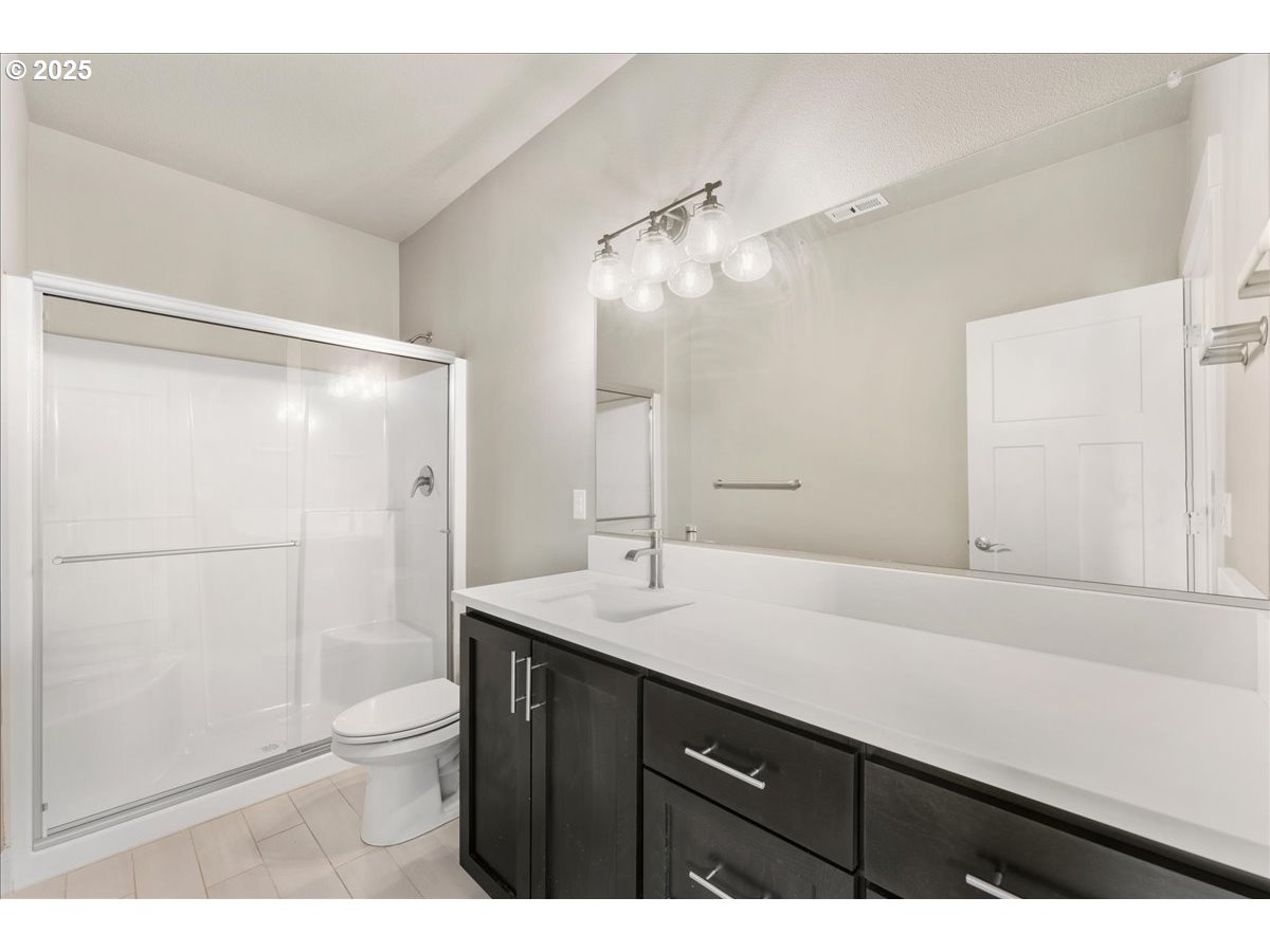 6452 Northwest Lambert Lane Camas, WA 98607 - Photo 19 of 43 a bathroom with a sink and a mirror