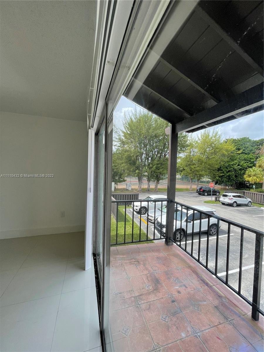 10802 Southwest 88th Street, Unit P2 Miami, FL 33176 - Photo 14 of 23 a view of porch with green space