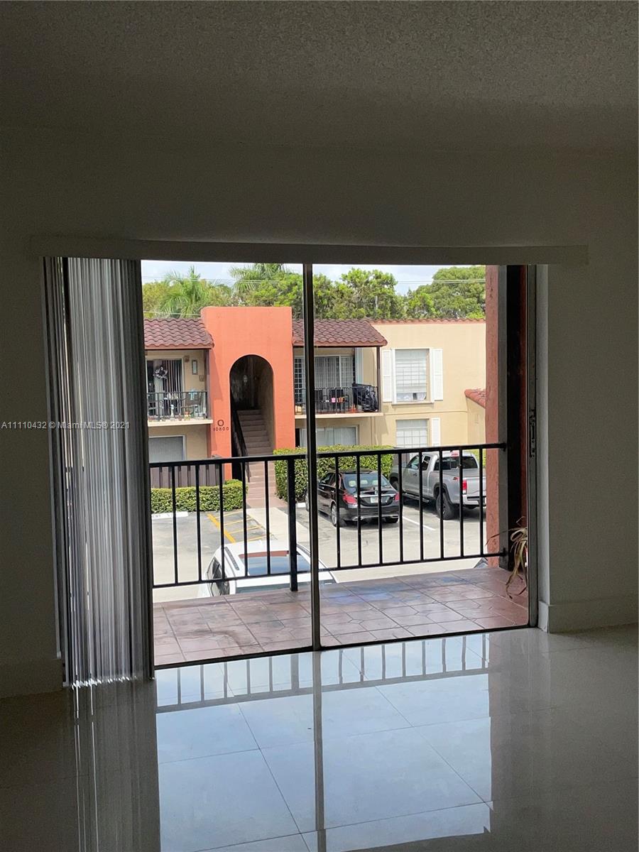 10802 Southwest 88th Street, Unit P2 Miami, FL 33176 - Photo 15 of 23 a view of porch with a swing
