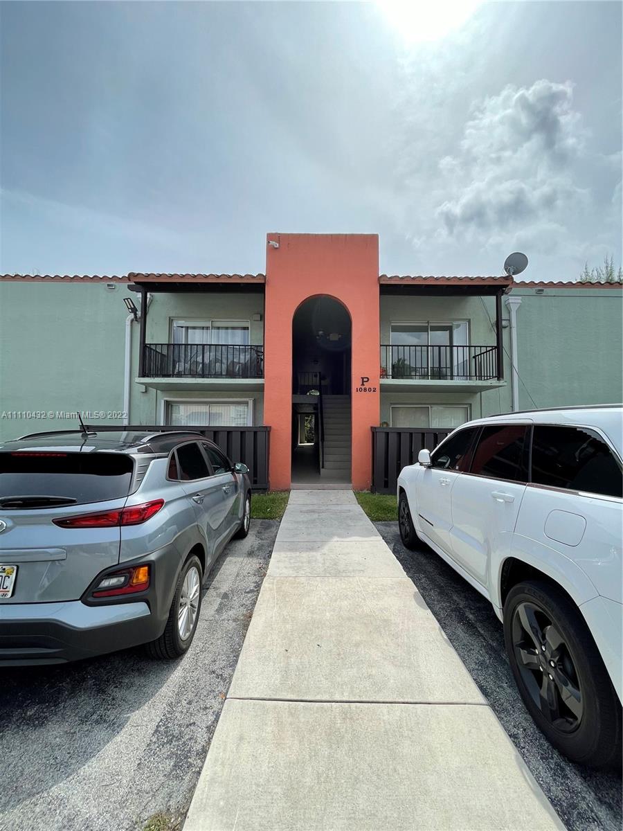 10802 Southwest 88th Street, Unit P2 Miami, FL 33176 - Photo 16 of 23 a car parked in front of a house