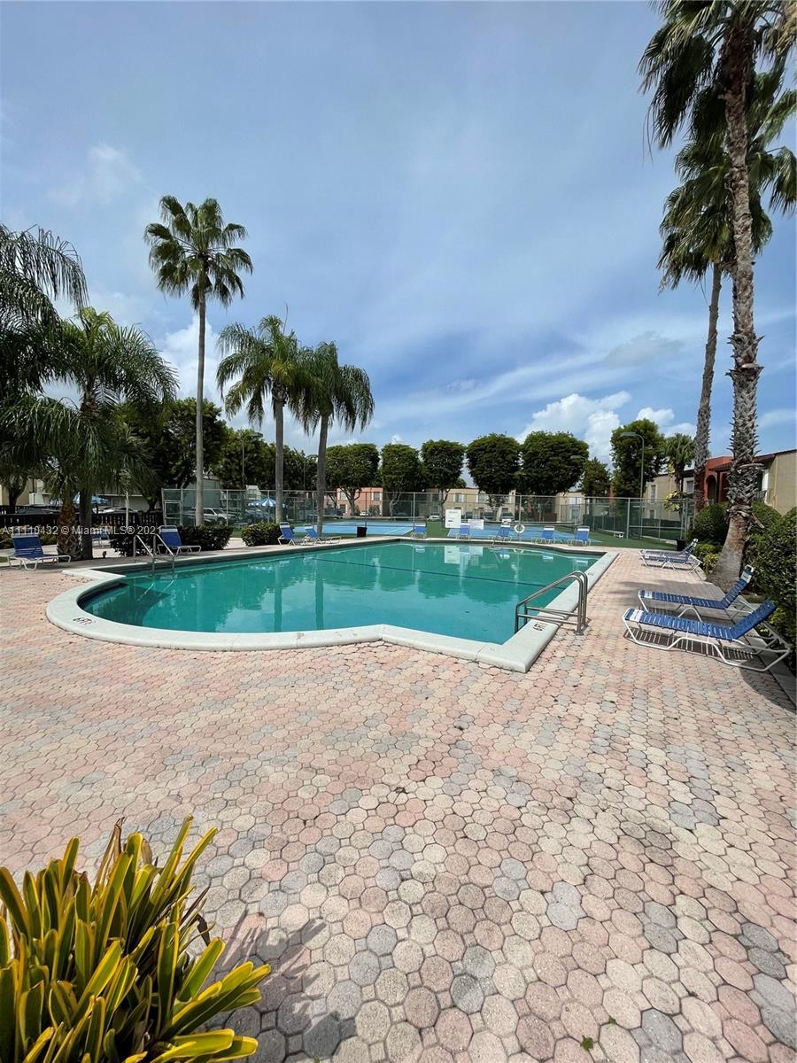 10802 Southwest 88th Street, Unit P2 Miami, FL 33176 - Photo 21 of 23 a view of a garden