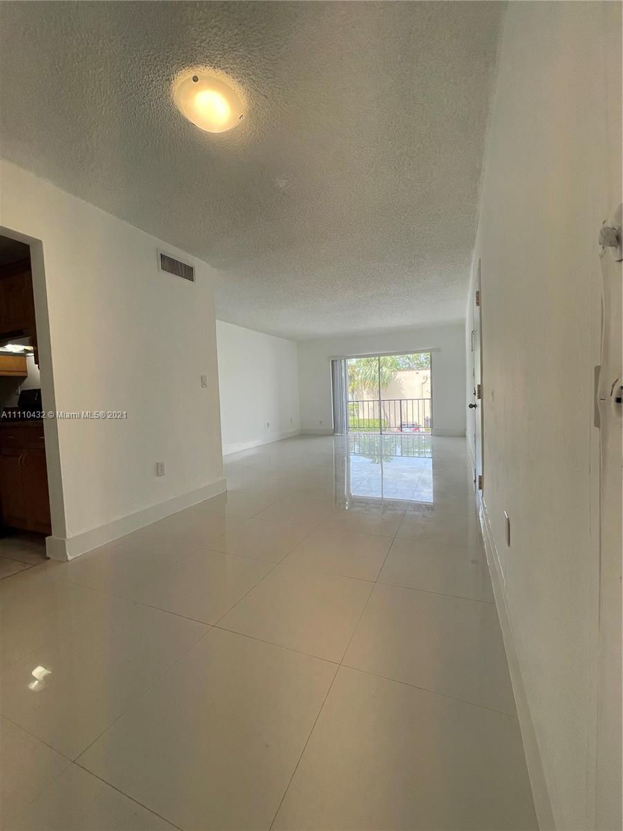 10802 Southwest 88th Street, Unit P2 Miami, FL 33176 - Photo 3 of 23 a view of empty room with window