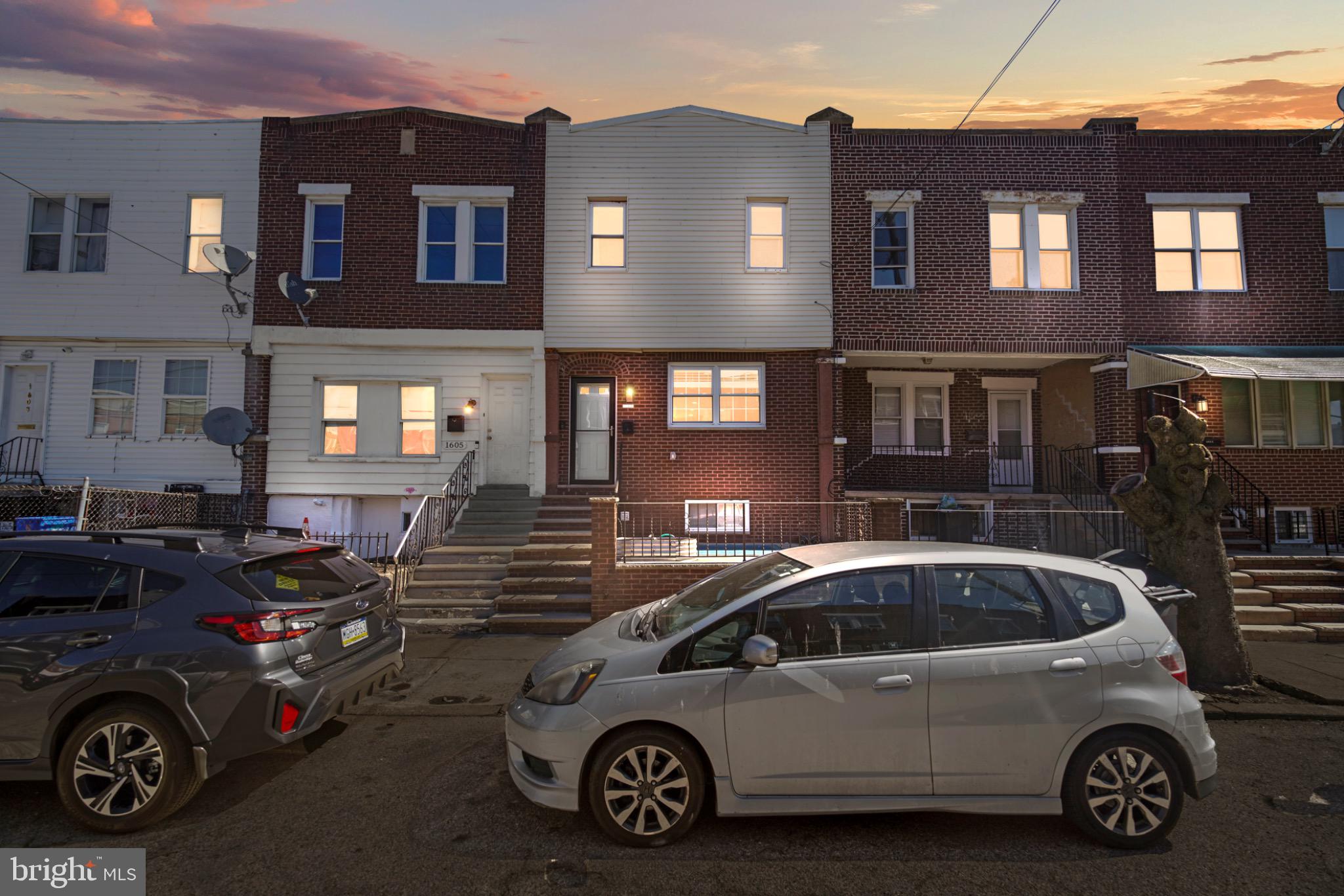1607 South 28th Street Philadelphia, PA 19145 - Photo 6 of 11 Charming row homes at twilight glow.