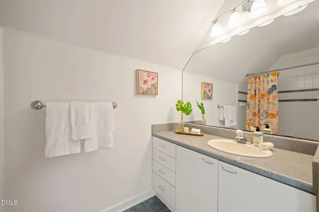 an empty room with closet and windows