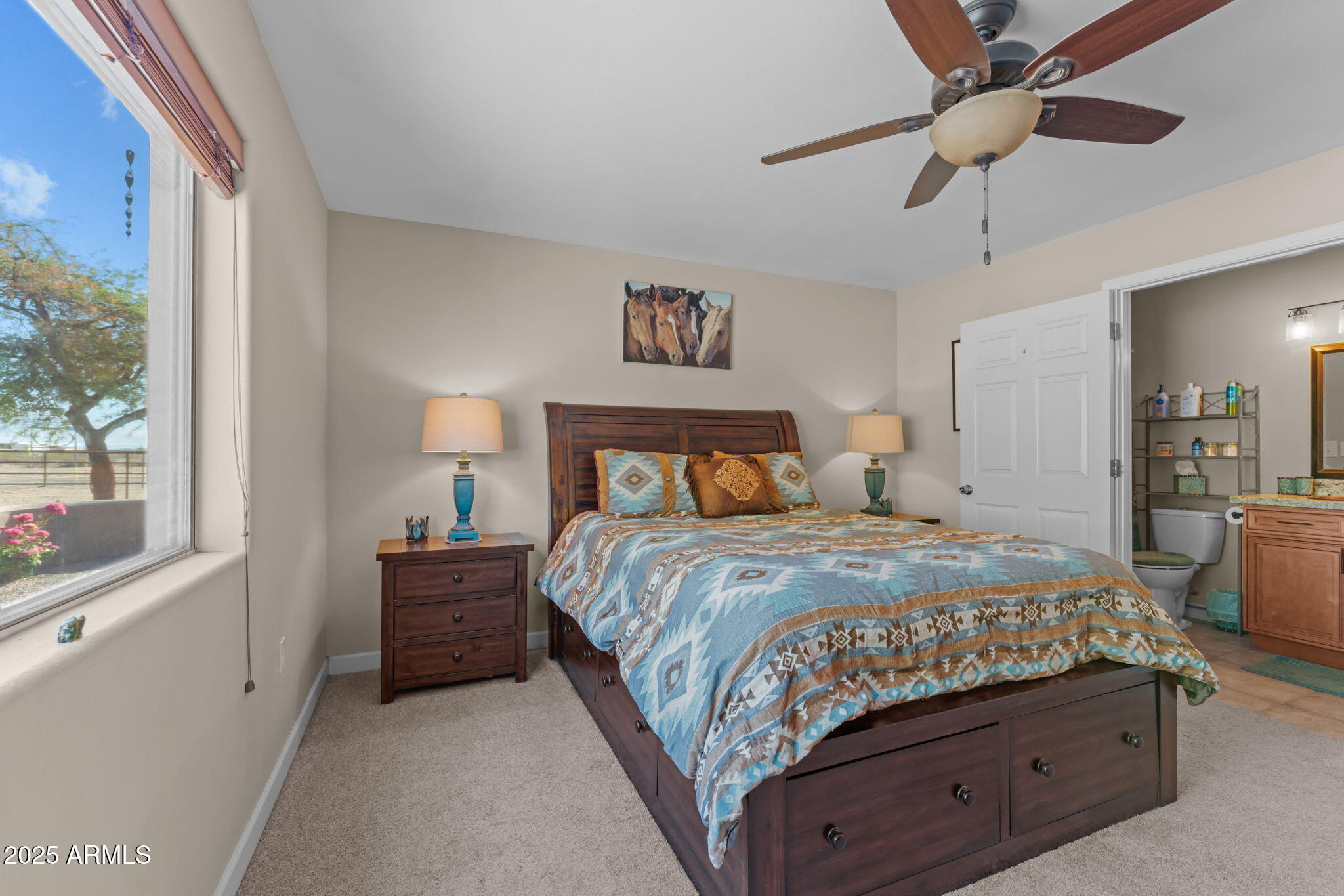22309 West Rancho Caliente Wittmann, AZ 85361 - Photo 23 of 44 a bedroom with a bed and a window