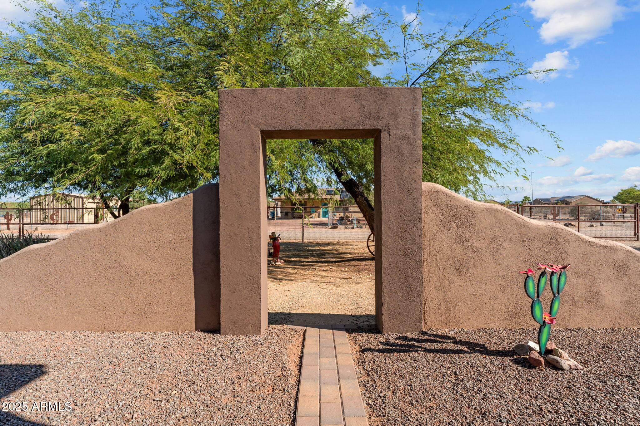 22309 West Rancho Caliente Wittmann, AZ 85361 - Photo 31 of 44 a view of a house with a tree in the background