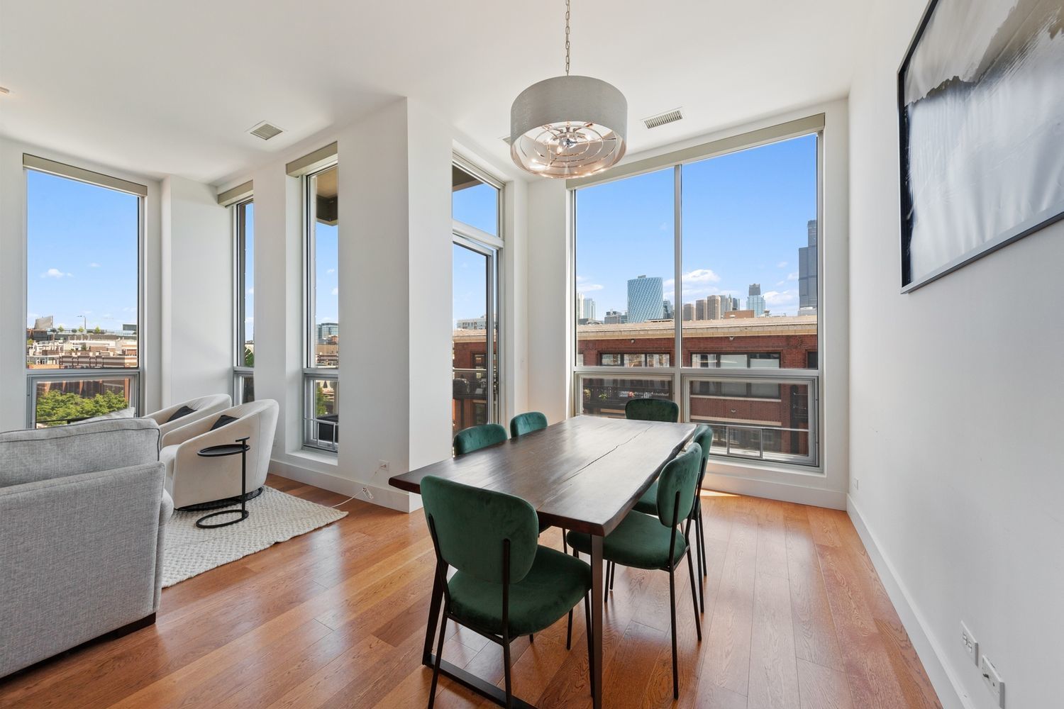 122 South Aberdeen Street, Unit 5N Chicago, IL 60607 - Photo 6 of 23 a view of a dining room with furniture window and wooden floor