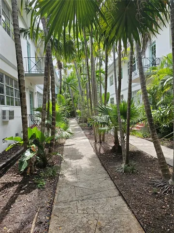 a view of a pathway with a patio