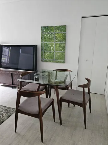 a view of a livingroom with furniture and a work space
