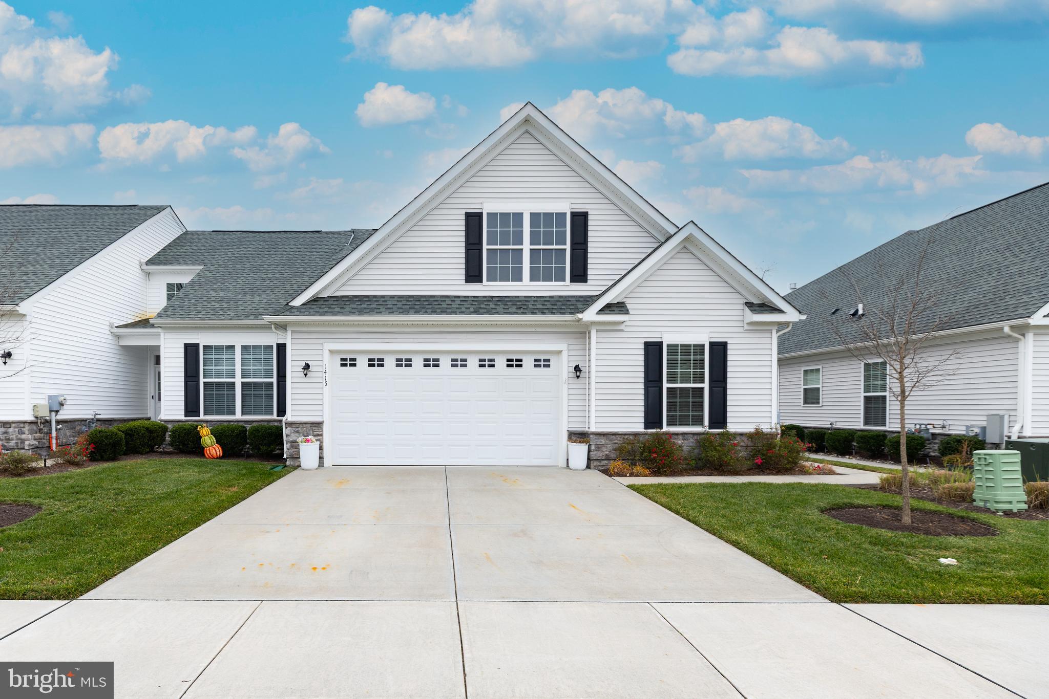 1415 Whispering Woods Road Middletown, DE 19709 - Photo 1 of 42 a front view of a house with a yard and garage
