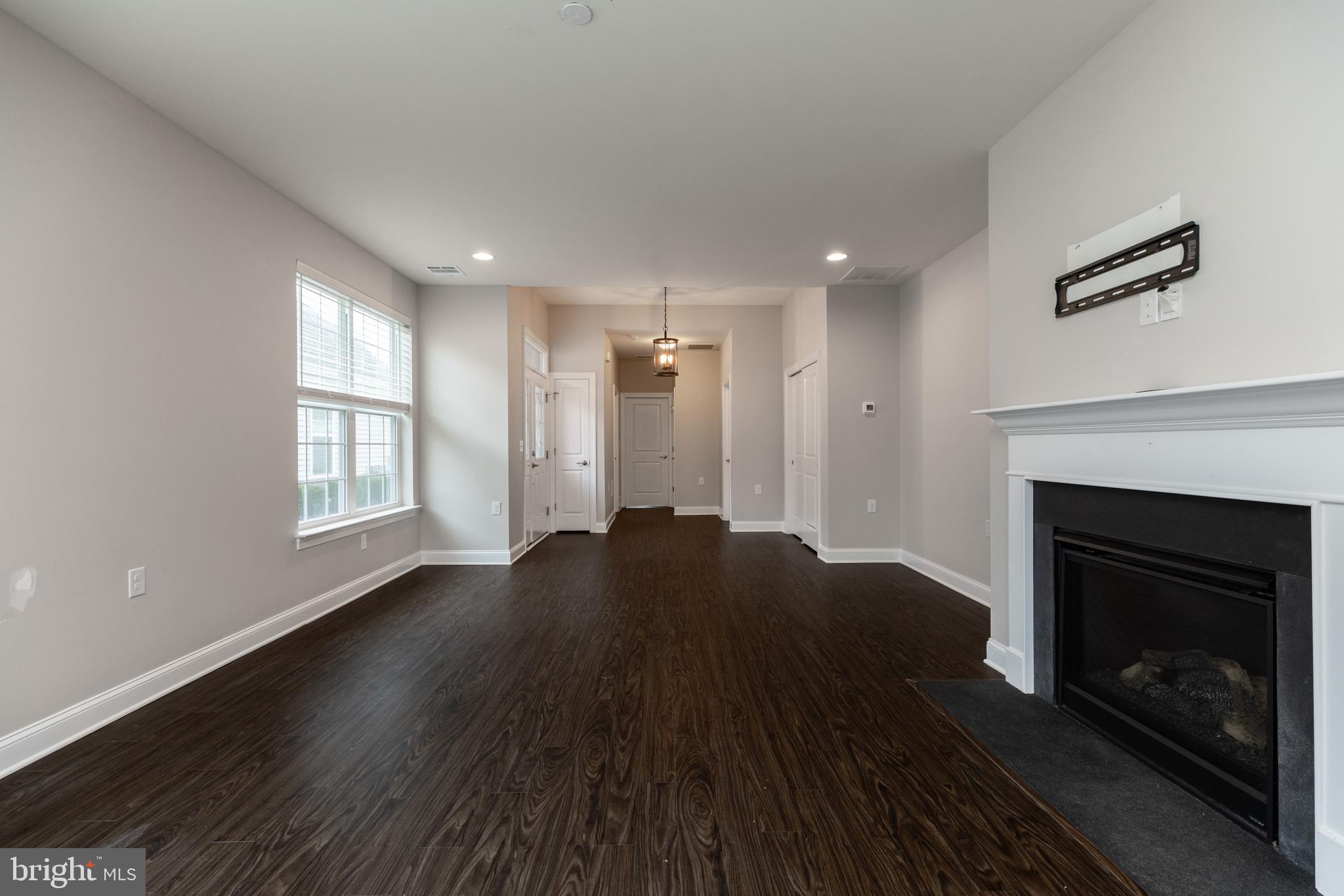 1415 Whispering Woods Road Middletown, DE 19709 - Photo 14 of 42 a living room with a fireplace