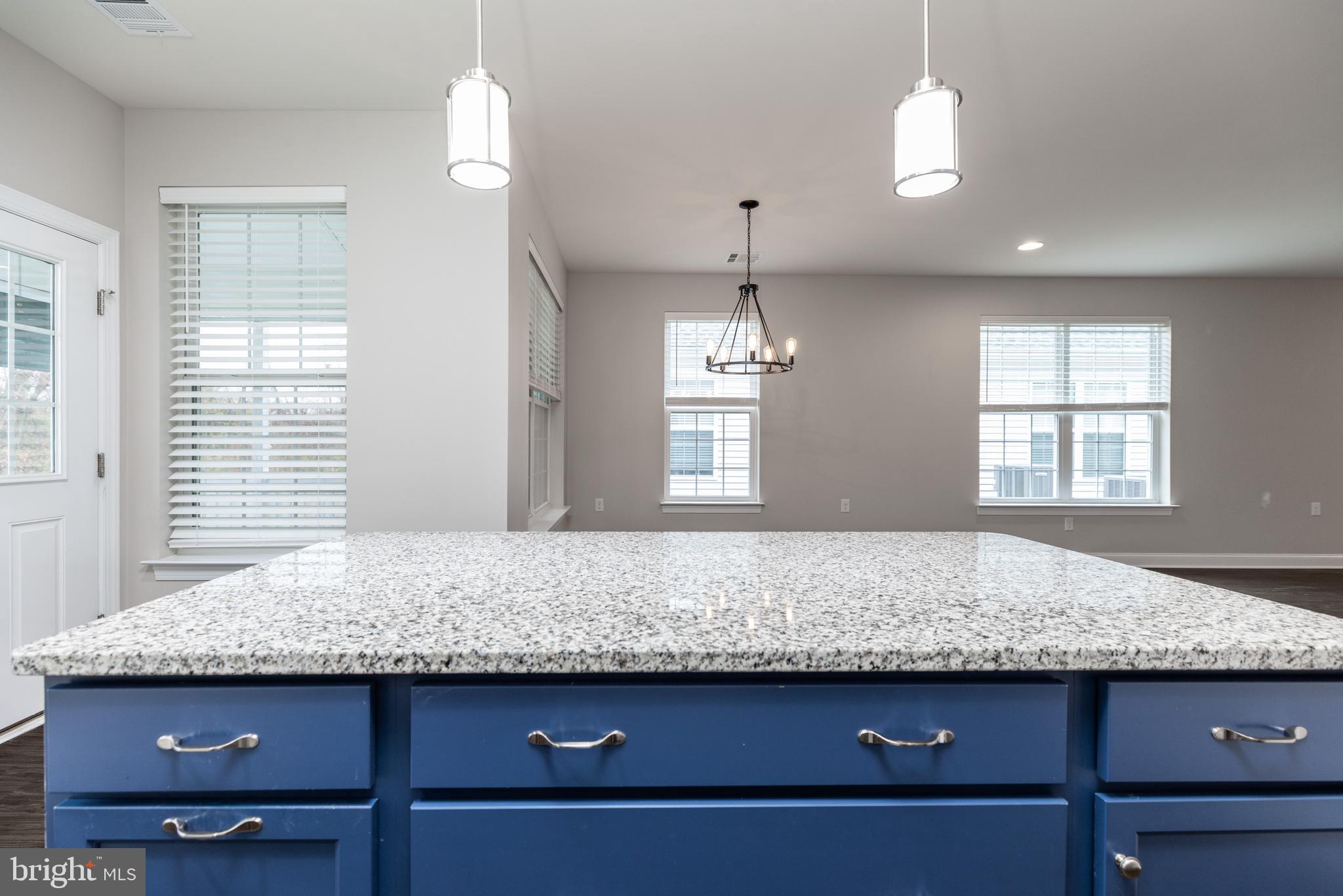 1415 Whispering Woods Road Middletown, DE 19709 - Photo 24 of 42 a view of kitchen with granite countertop cabinets and window