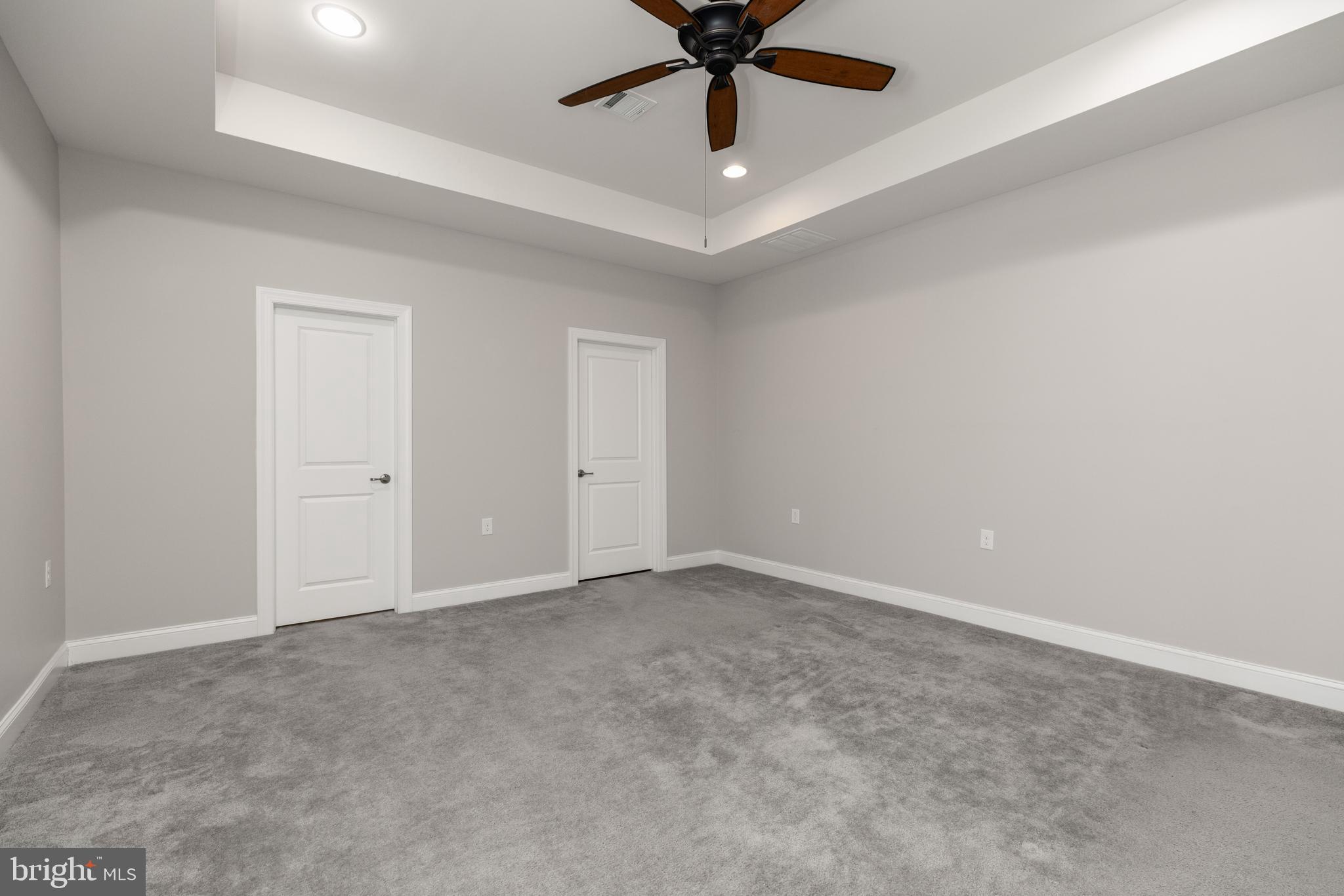 1415 Whispering Woods Road Middletown, DE 19709 - Photo 25 of 42 an empty room with a window and a fan