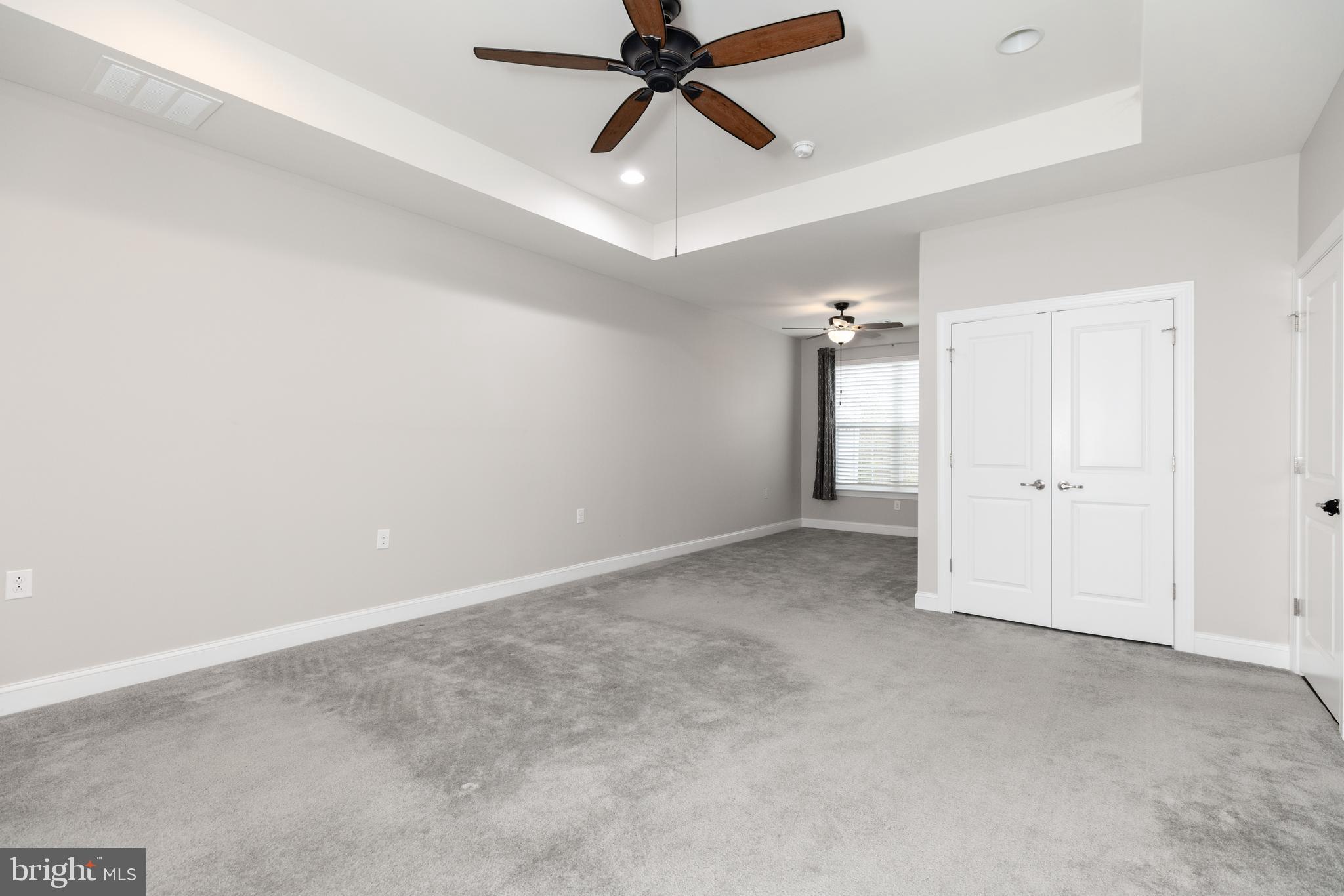 1415 Whispering Woods Road Middletown, DE 19709 - Photo 26 of 42 an empty room and chandelier fan