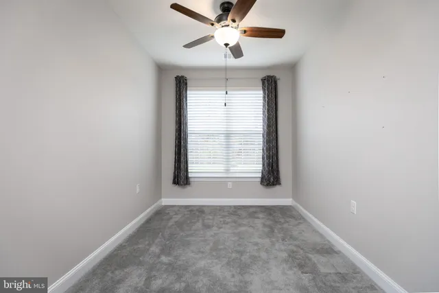 an empty room with a empty space and windows