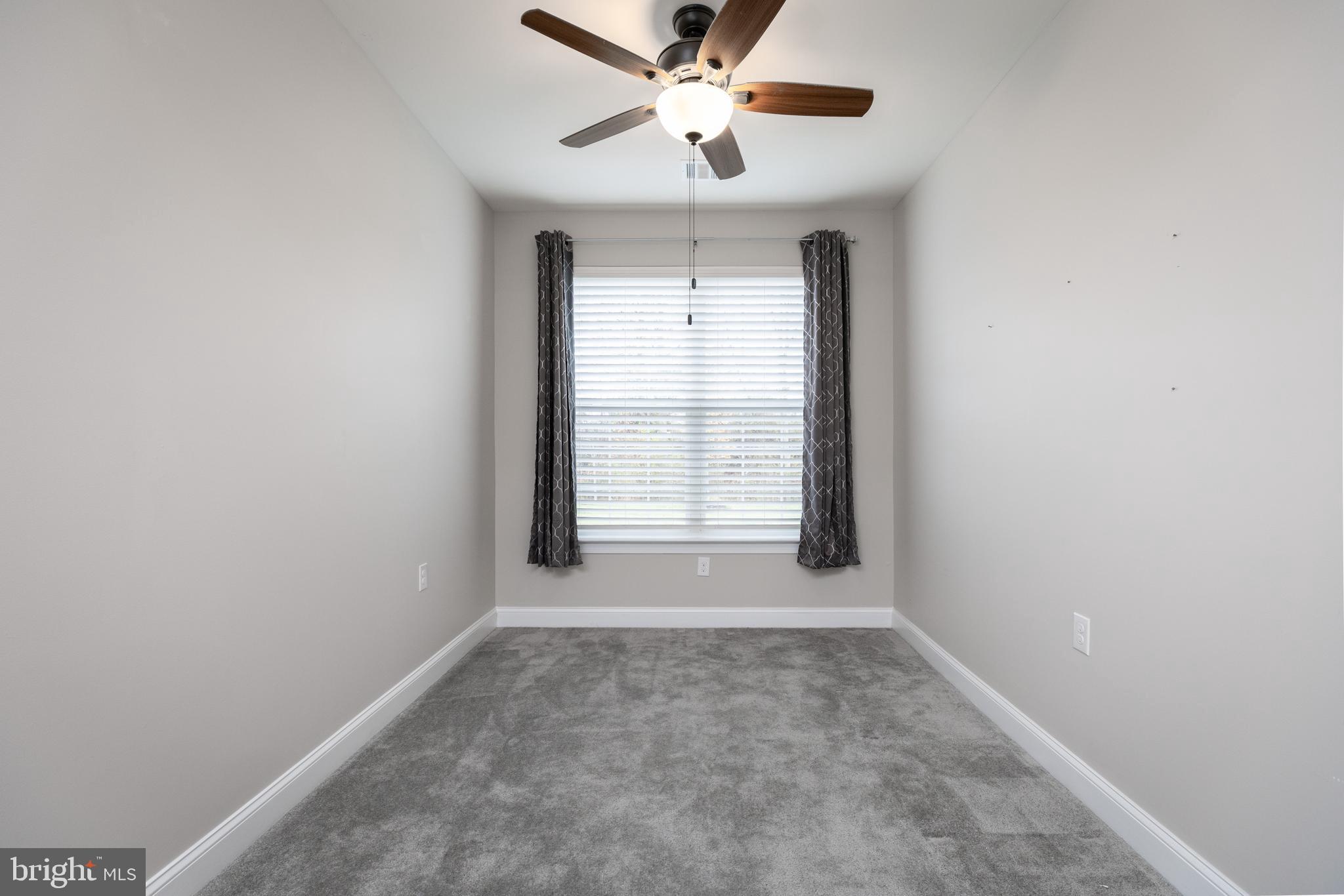 1415 Whispering Woods Road Middletown, DE 19709 - Photo 28 of 42 a view of an empty room with a window