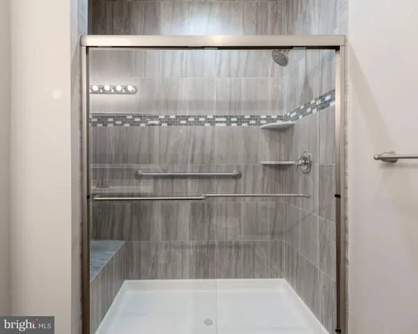 a bathroom with a sink a toilet and a window