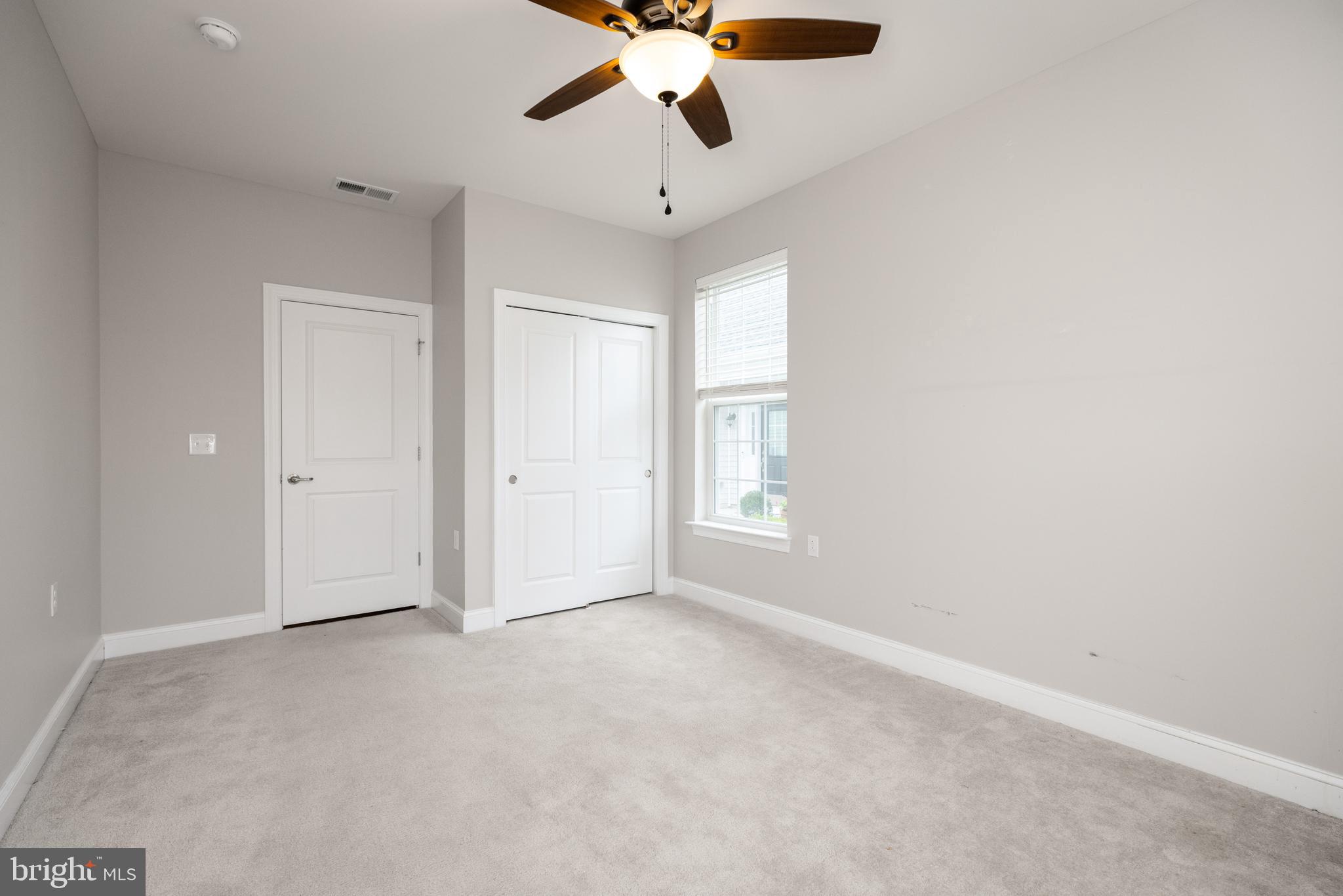 1415 Whispering Woods Road Middletown, DE 19709 - Photo 37 of 42 a view of an empty room and chandelier fan