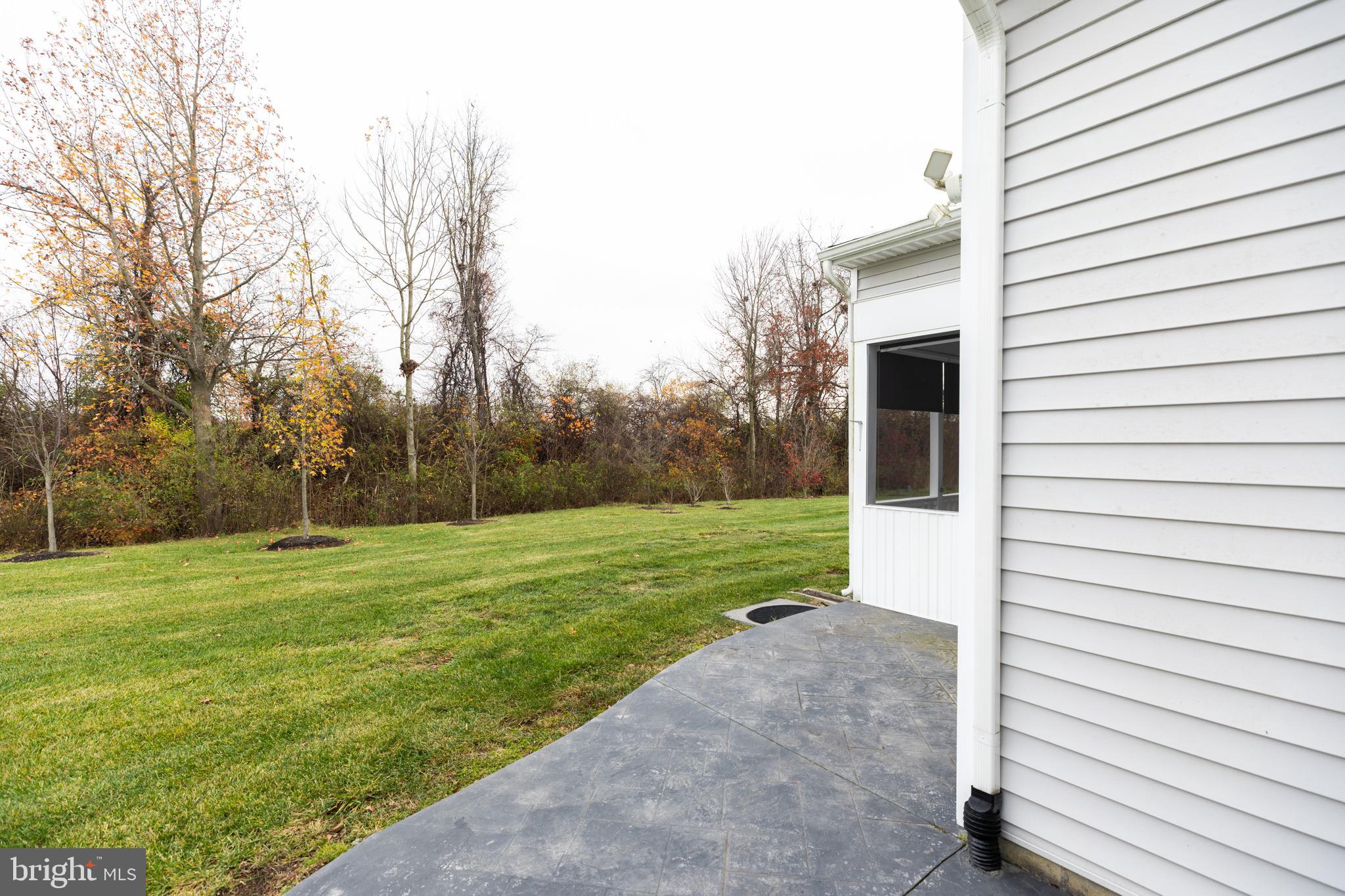 1415 Whispering Woods Road Middletown, DE 19709 - Photo 40 of 42 a view of a porch with a yard