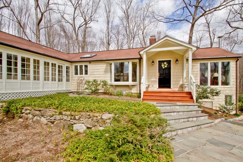 front view of a house with a yard