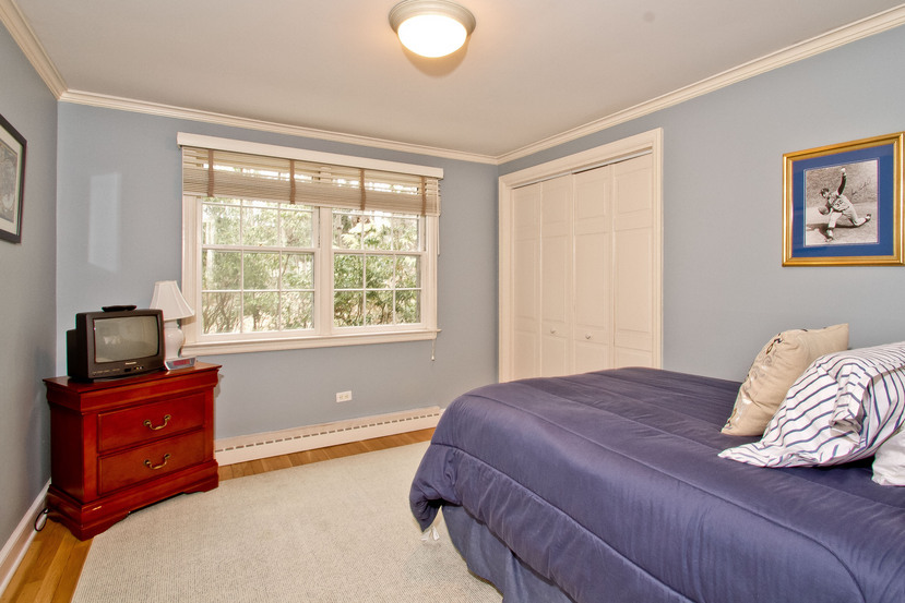 1039 Valley Road New Canaan, CT 06840 - Photo 14 of 17 a bedroom with a bed and furniture
