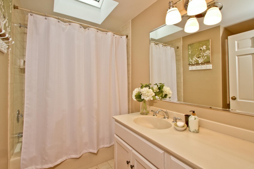 1039 Valley Road New Canaan, CT 06840 - Photo 15 of 17 a bathroom with a granite countertop sink and a mirror