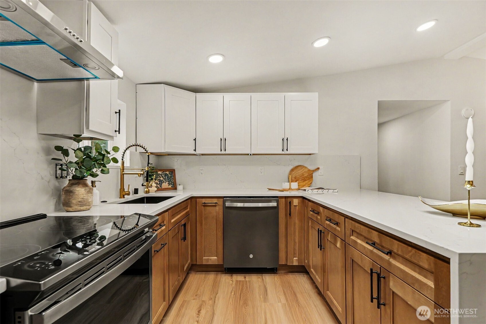 719 Tiedman Road Southwest Lakebay, WA 98349 - Photo 11 of 40 a kitchen with a sink stove and cabinets