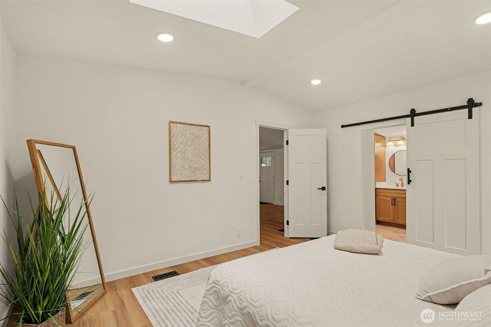 719 Tiedman Road Southwest Lakebay, WA 98349 - Photo 23 of 40 a bedroom with a bed and a large mirror