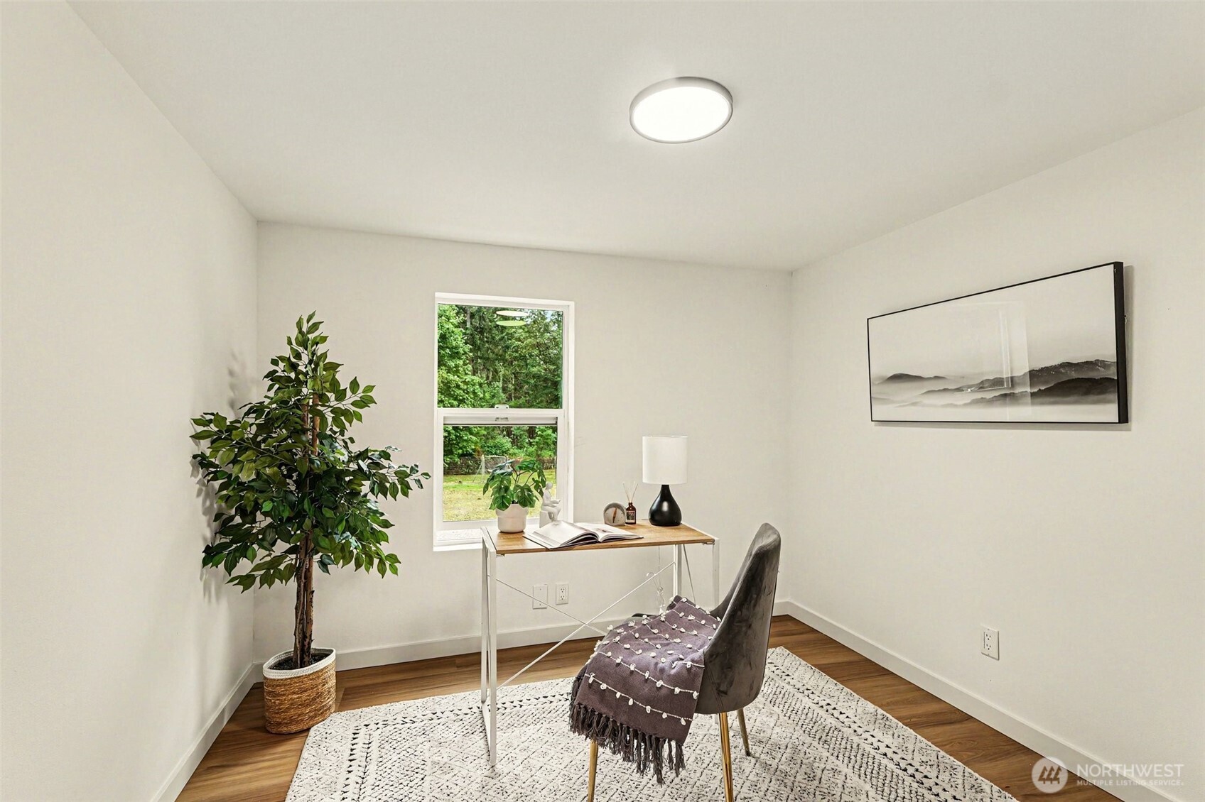 719 Tiedman Road Southwest Lakebay, WA 98349 - Photo 27 of 40 a living room with furniture and a potted plant
