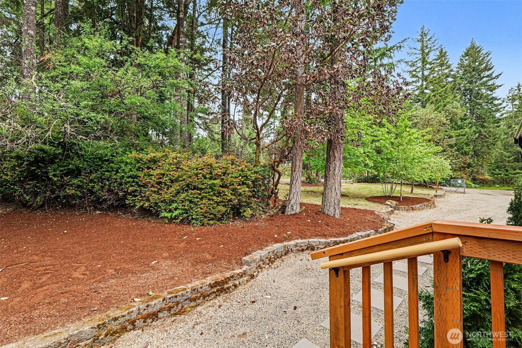 719 Tiedman Road Southwest Lakebay, WA 98349 - Photo 32 of 40 a view of a yard with plants and trees
