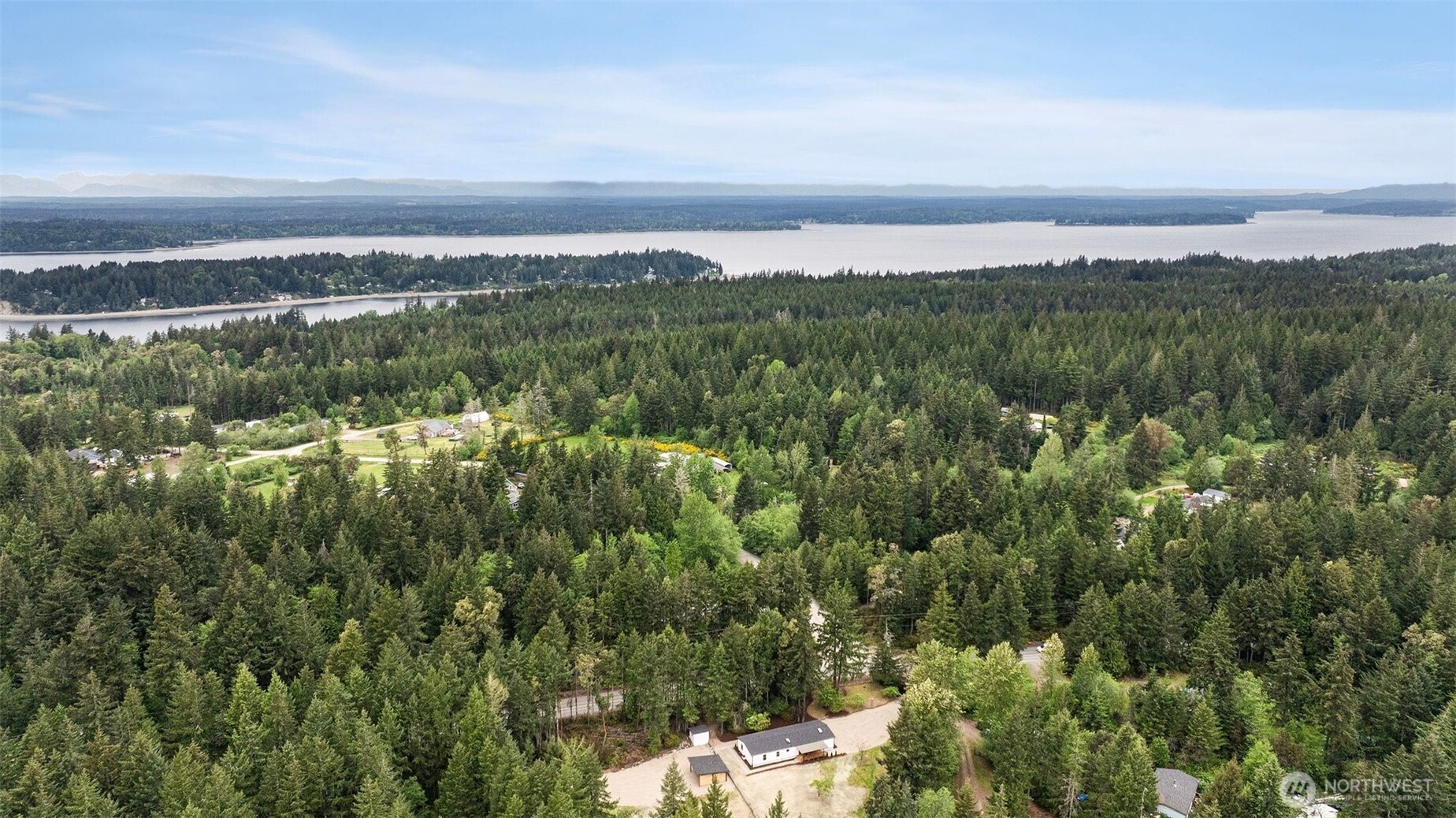 719 Tiedman Road Southwest Lakebay, WA 98349 - Photo 37 of 40 a view of a city with lush green forest