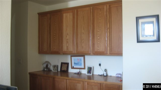 14090 Tagor Drive Reno, NV 89521 - Photo 3 of 13 a kitchen with a sink cabinets and window