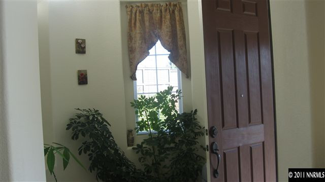14090 Tagor Drive Reno, NV 89521 - Photo 4 of 13 a view of a hallway to a door