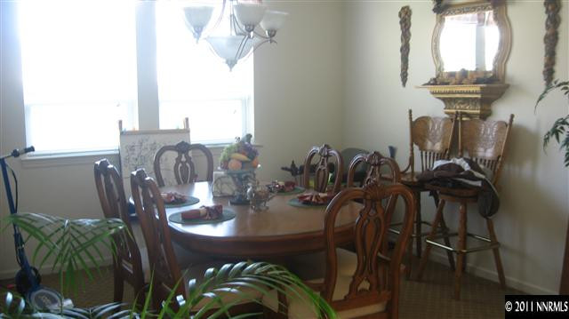 14090 Tagor Drive Reno, NV 89521 - Photo 5 of 13 a view of a dining room with furniture and chandelier