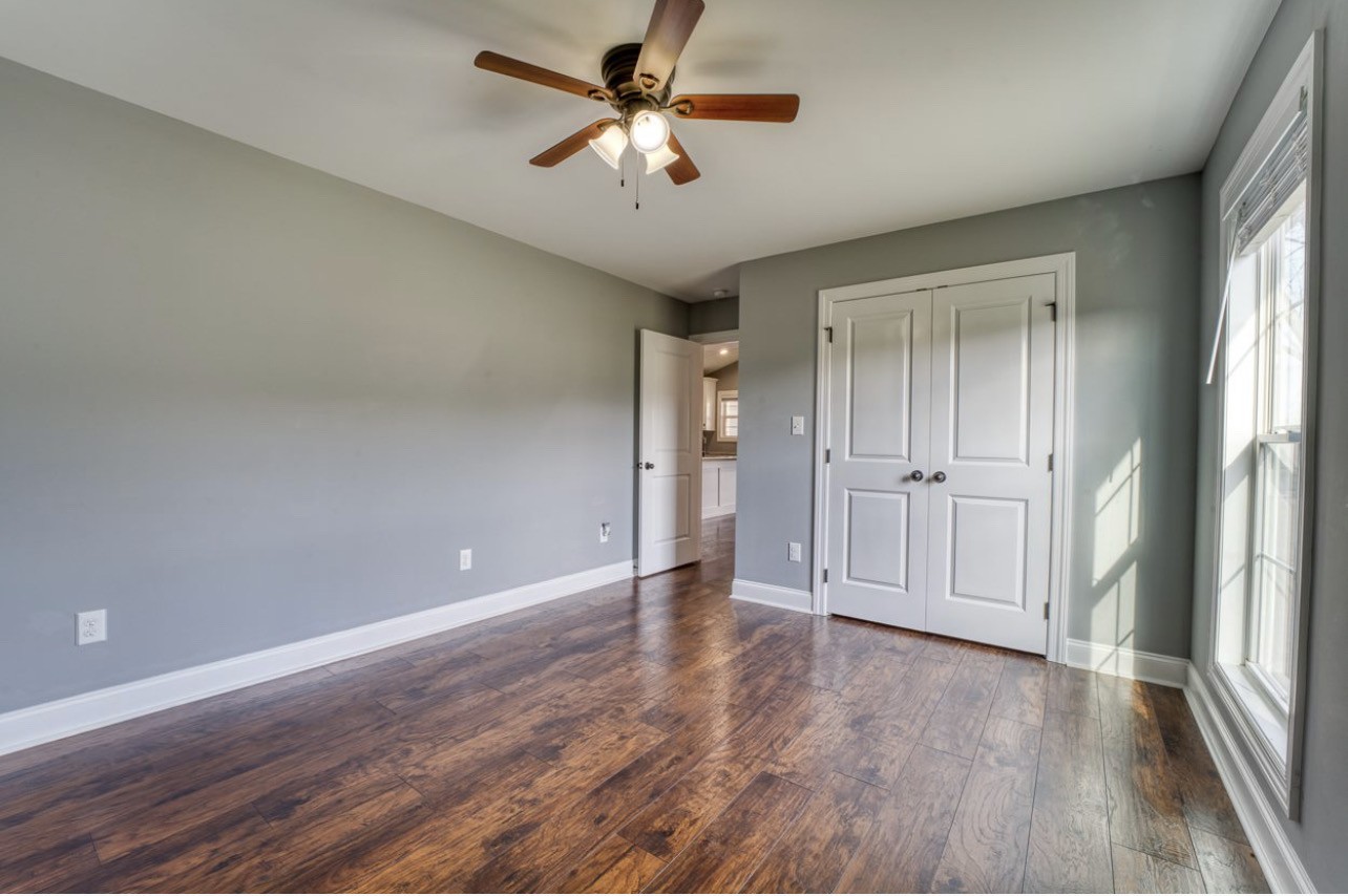 807 Clear Creek Road Pulaski, TN 38478 - Photo 9 of 17 a view of empty room with wooden floor and fan