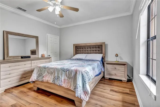 a bathroom with a granite countertop toilet sink and mirror