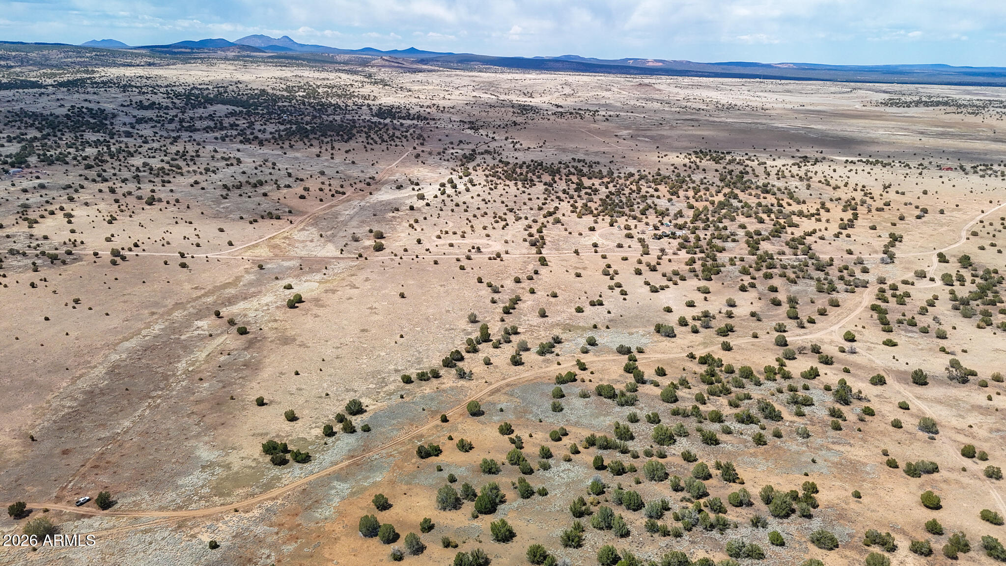 0 West Mile High Road, Unit 84 Ash Fork, AZ 86320 - Photo 5 of 22 a view of a dry yard with wooden floor