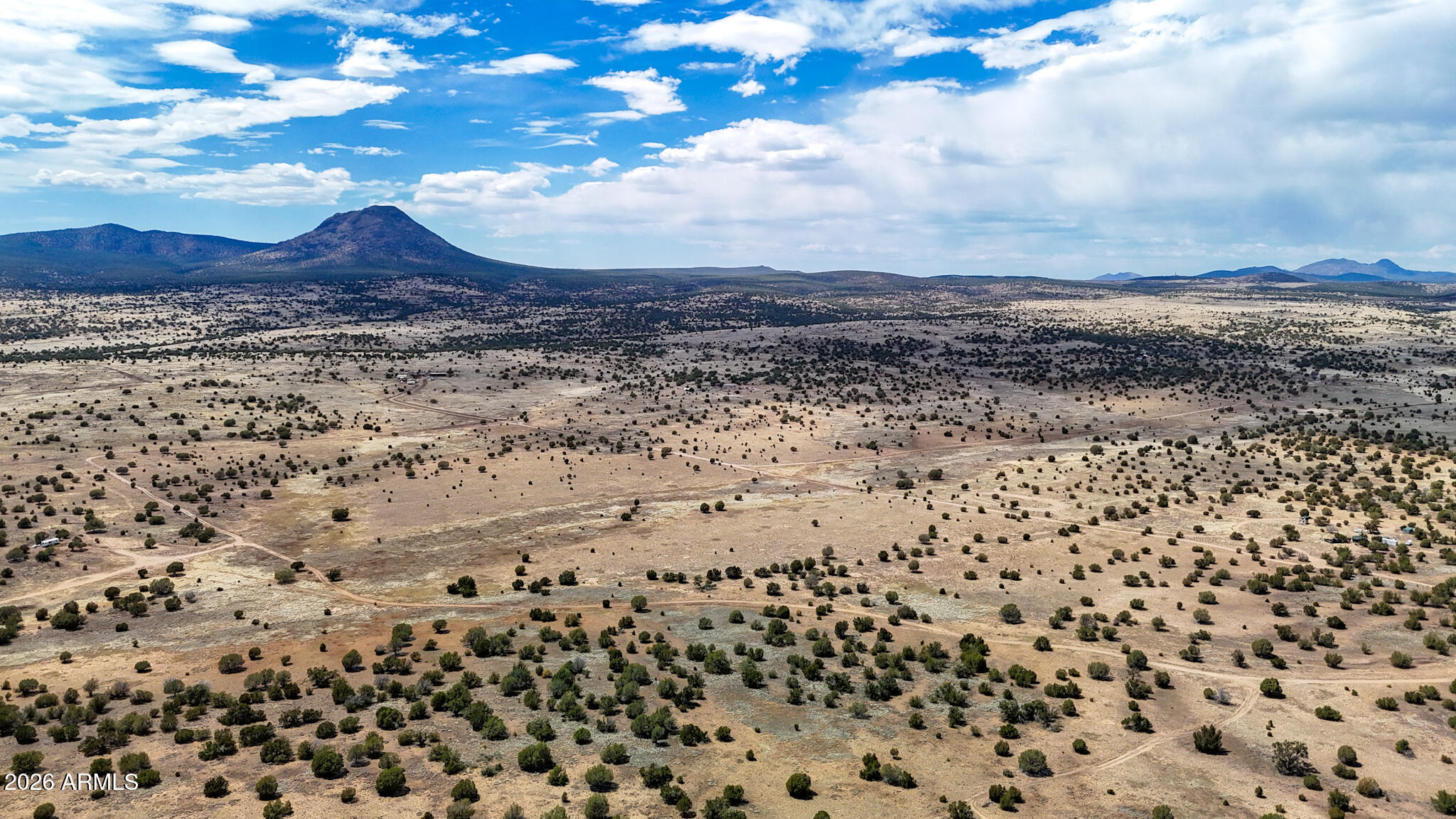 0 West Mile High Road, Unit 84 Ash Fork, AZ 86320 - Photo 9 of 22 a view of a large building with a mountain in the background