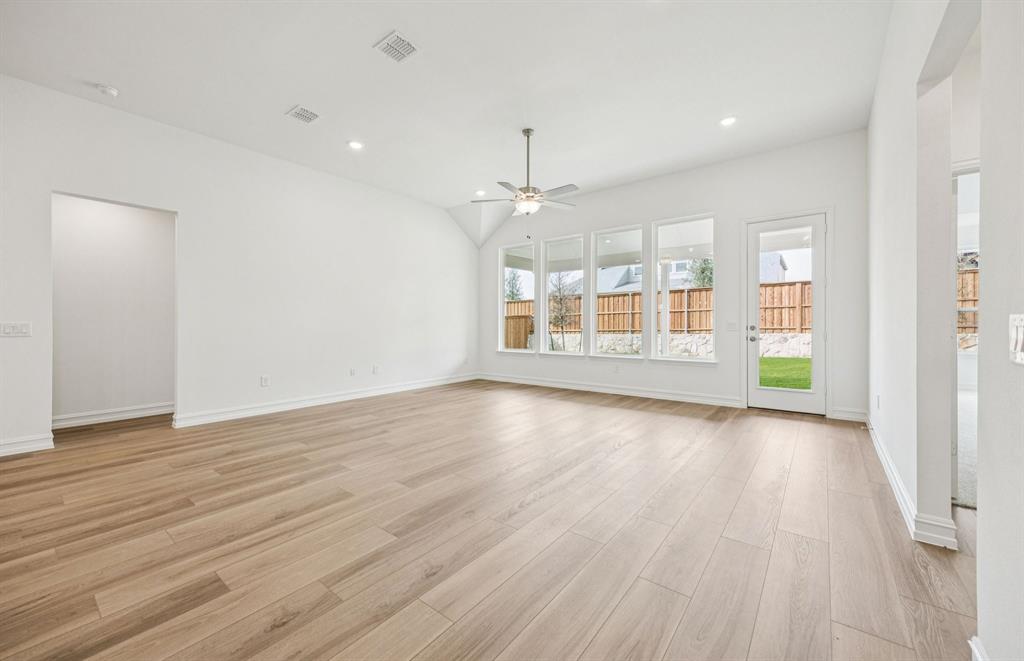 1837 Naseby Road Fort Worth, TX 76052 - Photo 3 of 9 Spacious gathering room with large windows *Model Representation*