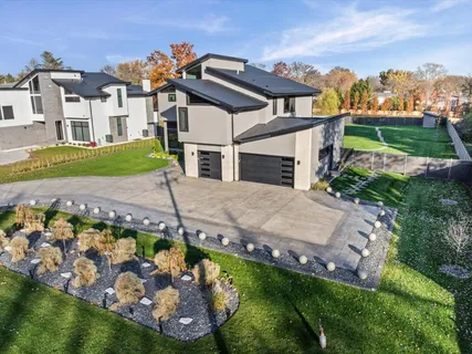 an aerial view of a house with a garden