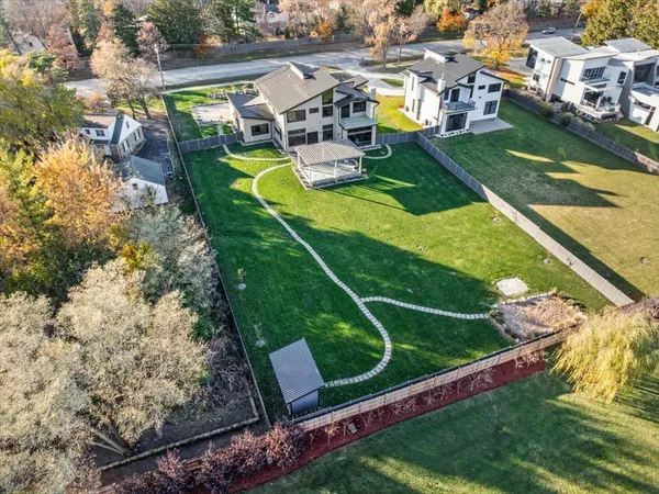 an aerial view of a house with a yard