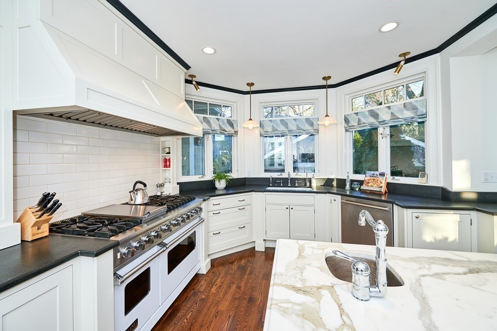 72 Pine Ridge Road Newton, MA 02468 - Photo 13 of 41 a kitchen with stainless steel appliances granite countertop a stove and a sink