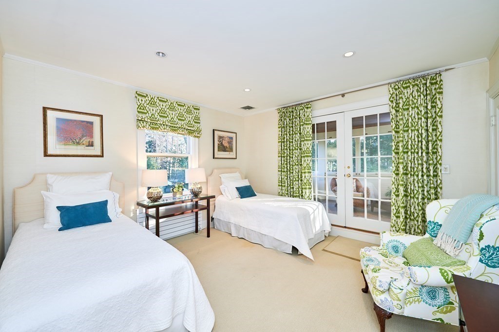 72 Pine Ridge Road Newton, MA 02468 - Photo 23 of 41 a bedroom with a bed and a couch