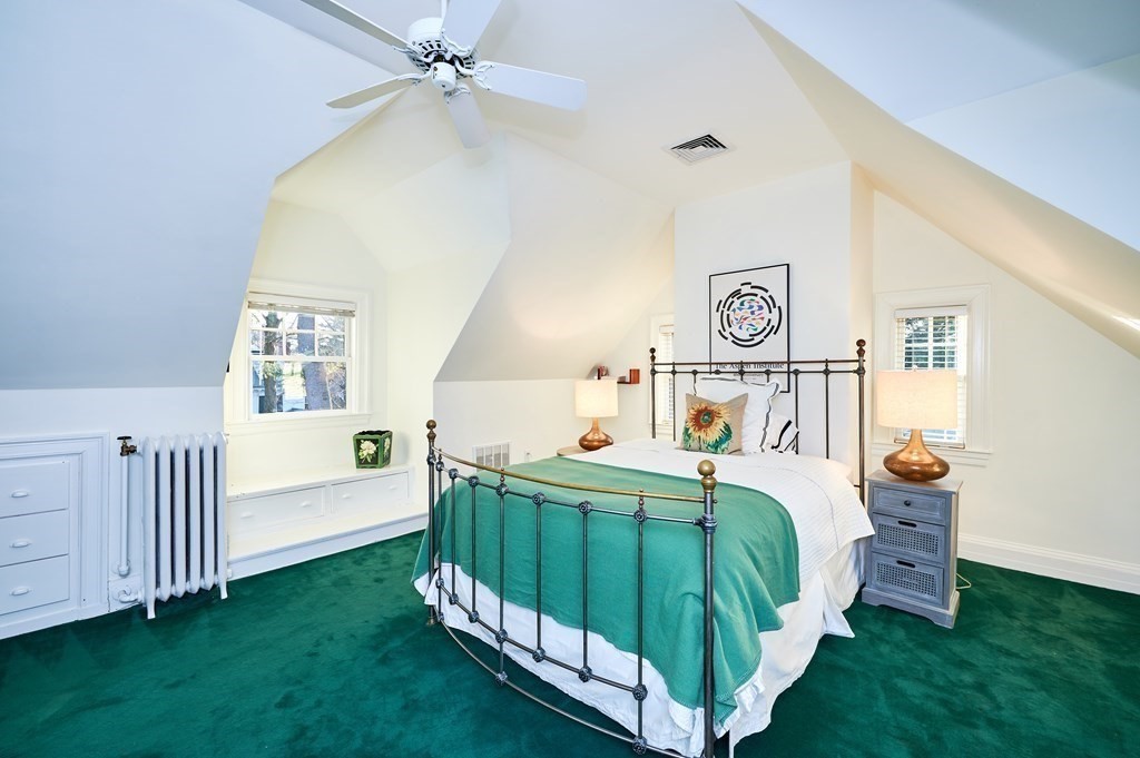 72 Pine Ridge Road Newton, MA 02468 - Photo 31 of 41 a bedroom with a bed and a chandelier