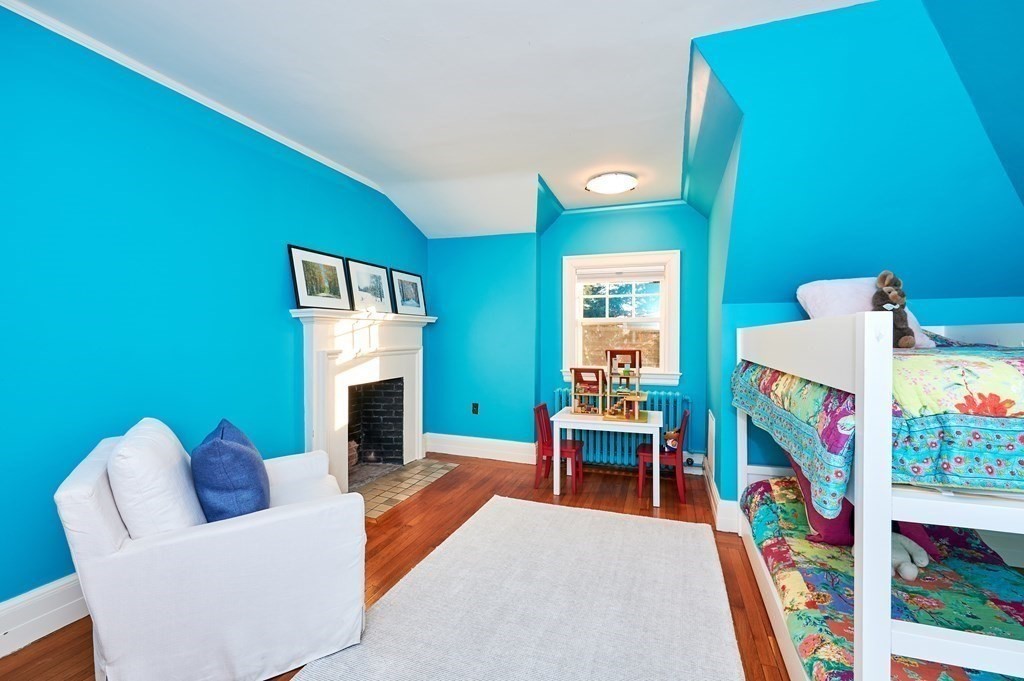 72 Pine Ridge Road Newton, MA 02468 - Photo 32 of 41 a living room with furniture and a fireplace