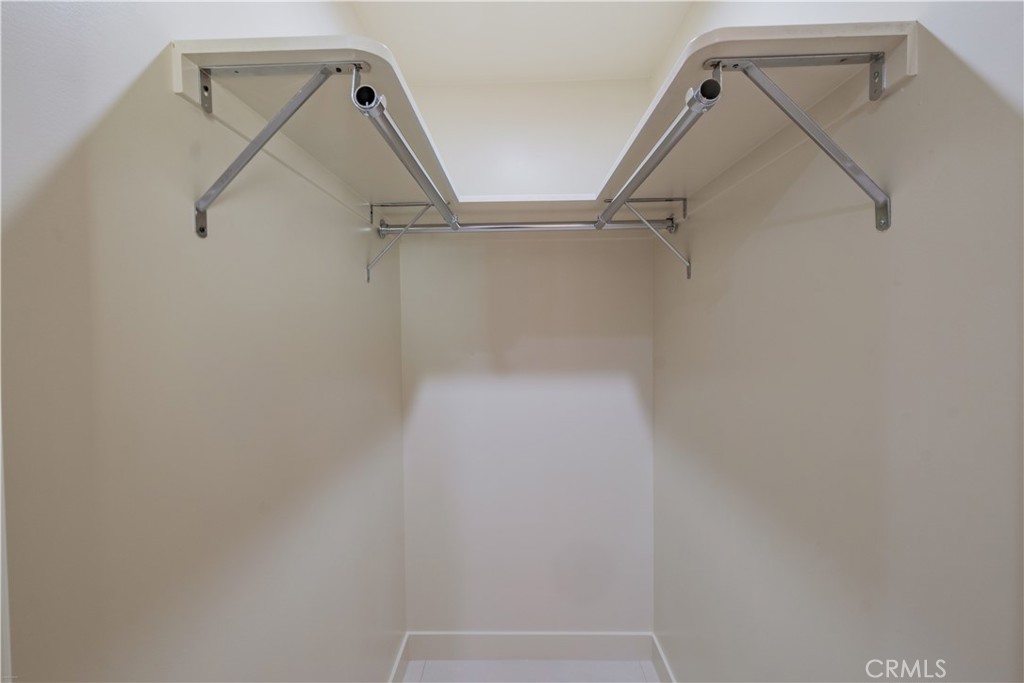 223 South Aprilia Avenue Compton, CA 90220 - Photo 40 of 46 a view of walk in closet with empty racks