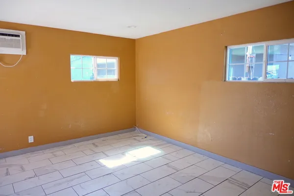 a view of an empty room with closet