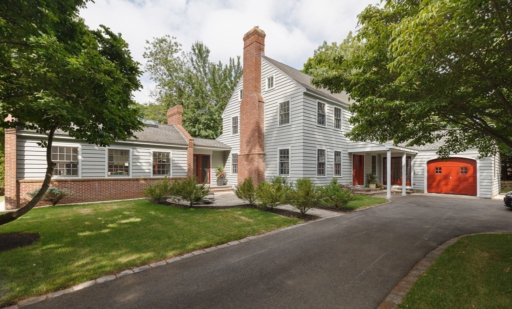 a front view of a house with a yard and porch