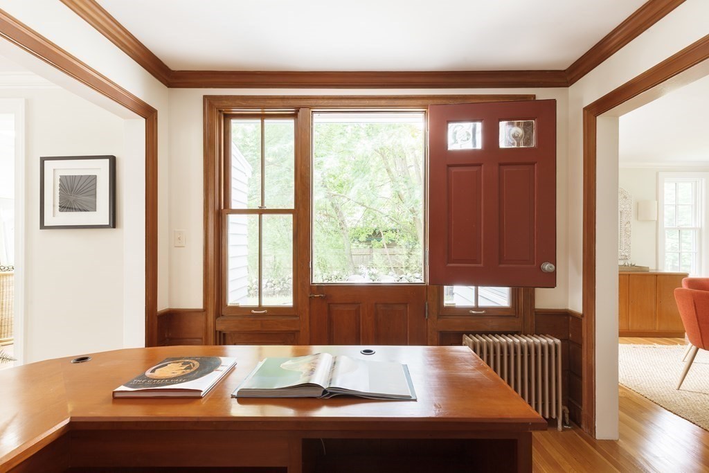 150 Fletcher Road Belmont, MA 02478 - Photo 16 of 33 a view of wooden floor and dining table in a living room