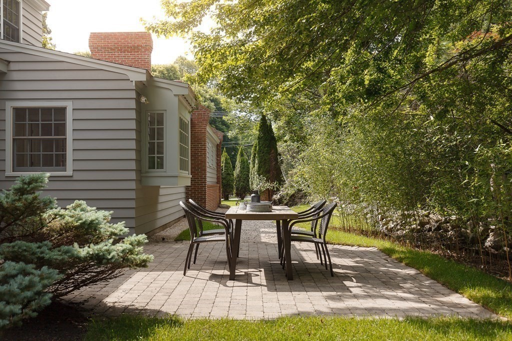 150 Fletcher Road Belmont, MA 02478 - Photo 17 of 33 a view of a patio with table and chairs and potted plants